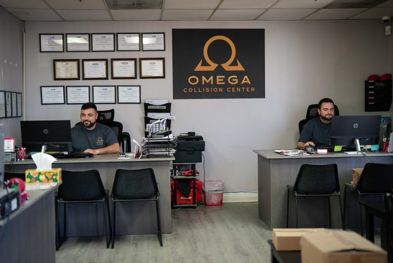 Omega Collision Center reception area and staff